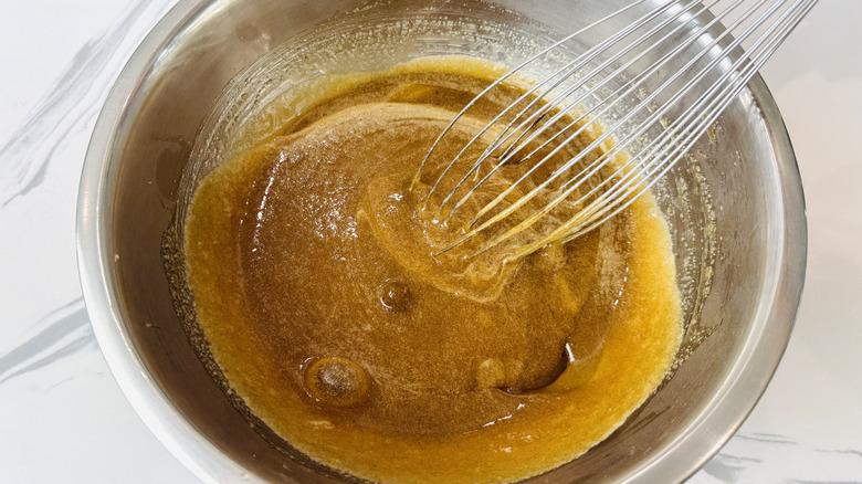 Whisking cake batter in bowl