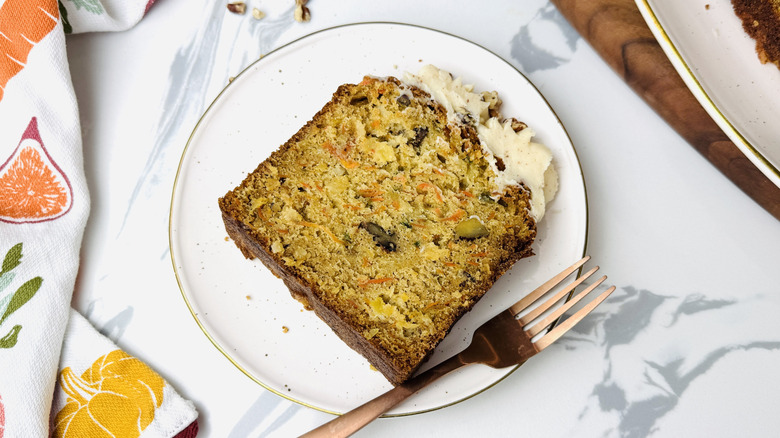 Slice of carrot pound cake with brown butter icing