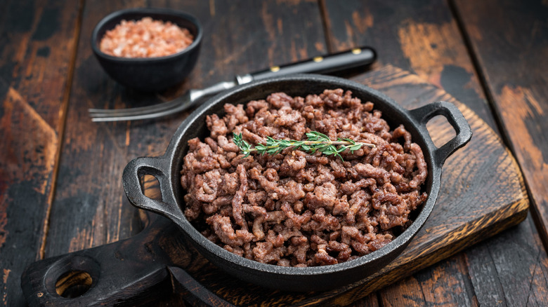 Cooked ground beef in skillet