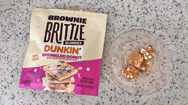 Dunkin' sprinkled doughnut Brownie Brittle pieces on a plate