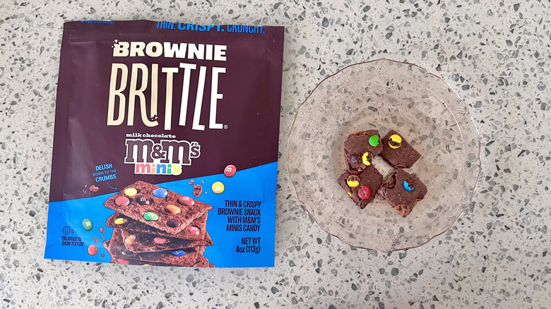 M&M Brownie Brittle pieces on a plate