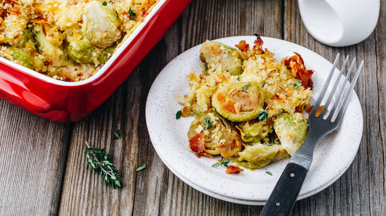 Baked Brussels sprouts on a plate with bacon