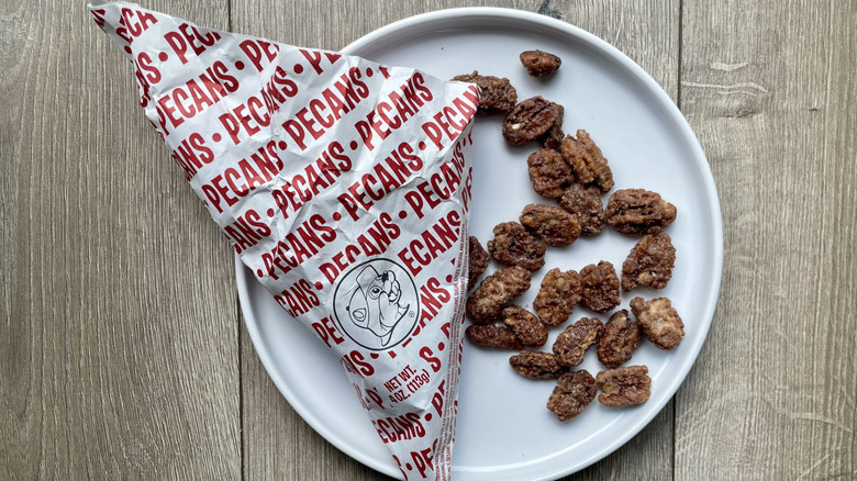 Bag of Buc-ee's candied pecans scattered on a plate