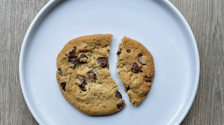 Broken chocolate chip cookie on a plate