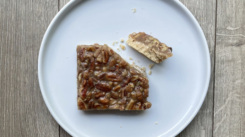 Sliced pecan bar on a plate