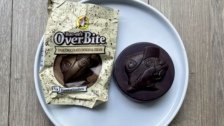Packaging and chocolate candy Overbite on a plate