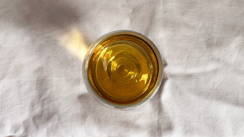 top down view of Buffalo Trace Single Oak on light pink fabric