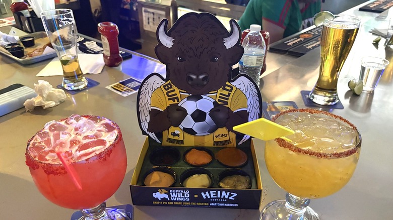 The Buffalo Wild Wings Around the World Dip Flight with two cocktails