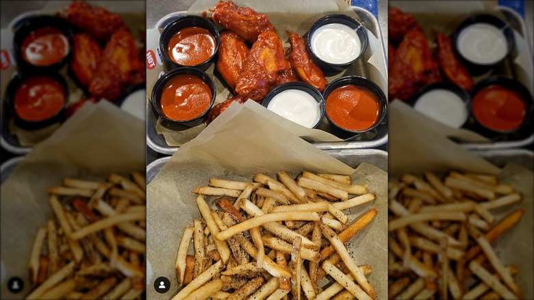 Buffalo Wild Wings chicken wings and fries with dipping sauces
