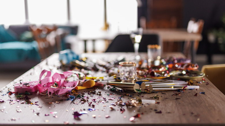 Close up shot of messy table with glitter and party supplies