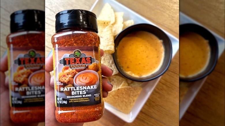 Hand holding Texas Roadhouse Rattlesnake Bites seasoning blend above a plate of tortilla chips
