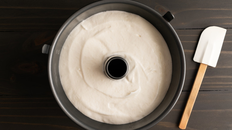 A smooth, light angel food cake batter inside of a tube pan seen from above
