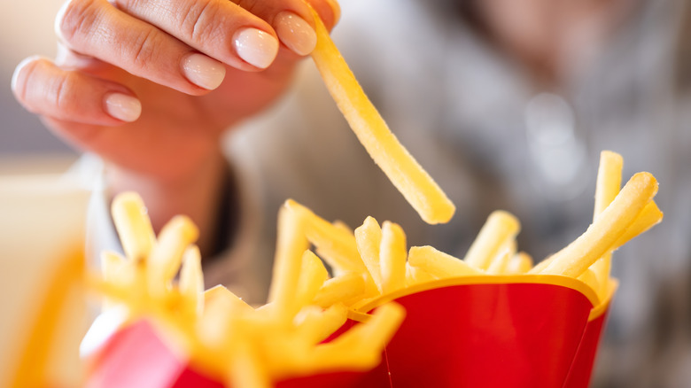 customer eating mcdonald's fries