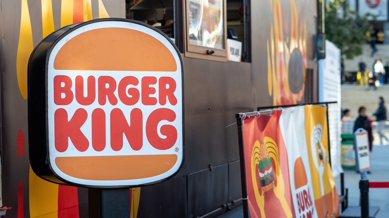 A Burger King sign inside of a restaurant