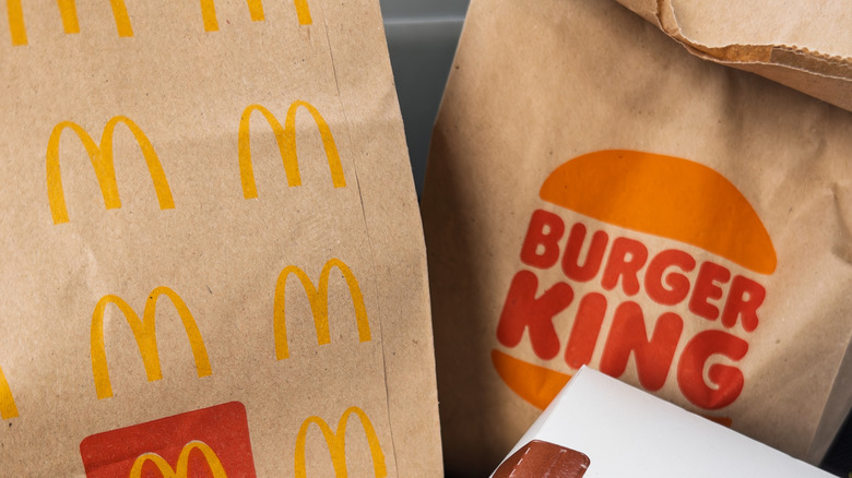 A McDonald's bag and a Burger King bag side by side