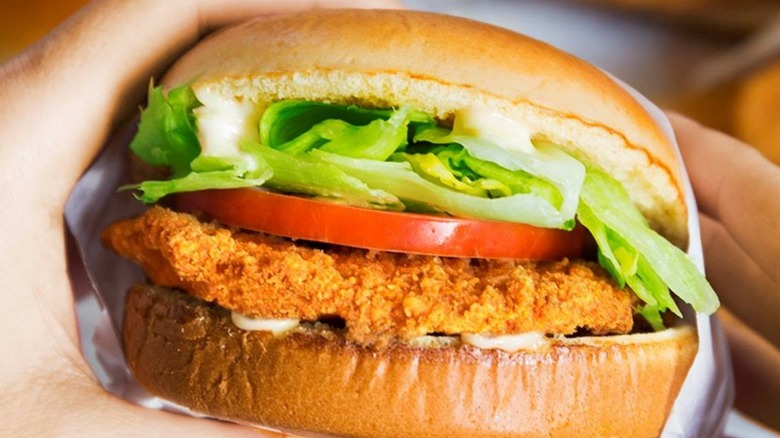 Customer holding Burger King chicken sandwich