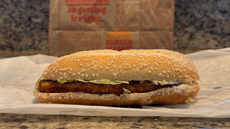 Burger King original chicken sandwich on opened wrapper on counter