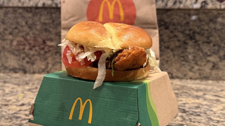 deluxe McCrispy sandwich on box on counter
