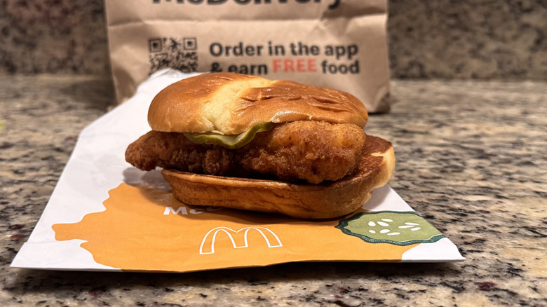 McCrispy sandwich on opened wrapper on counter