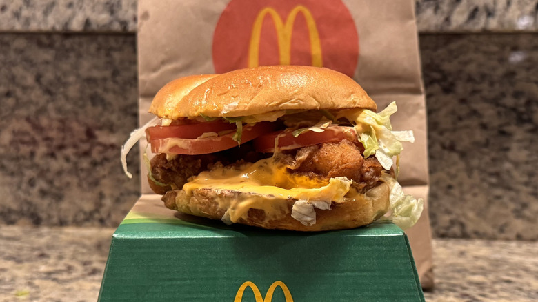 spicy deluxe McCrispy sandwich on box on counter