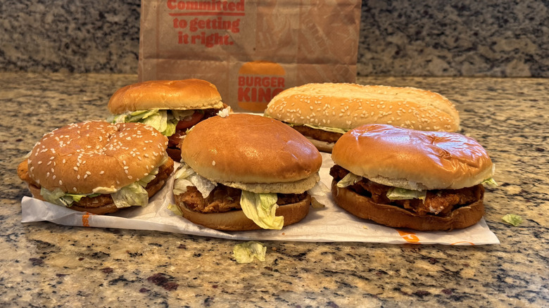 various Burger King chicken sandwiches on counter displayed