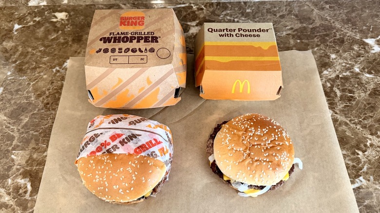 overhead shot of Whopper and Quarter Pounder in packaging