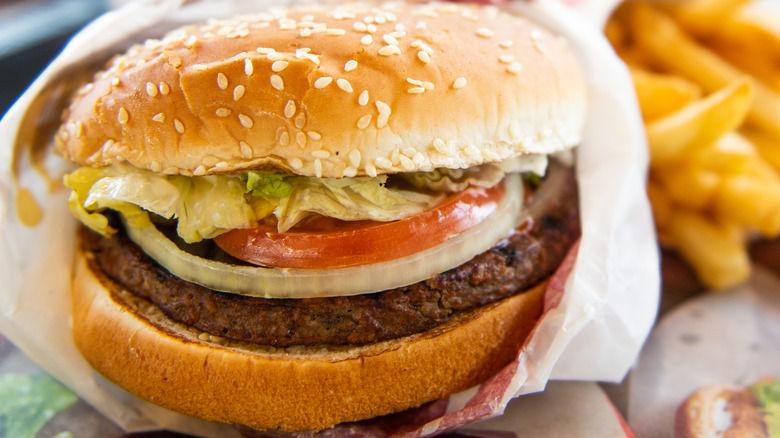 Whopper burger with fries on side