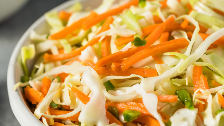 Close up of cabbage, carrot, pepper slaw
