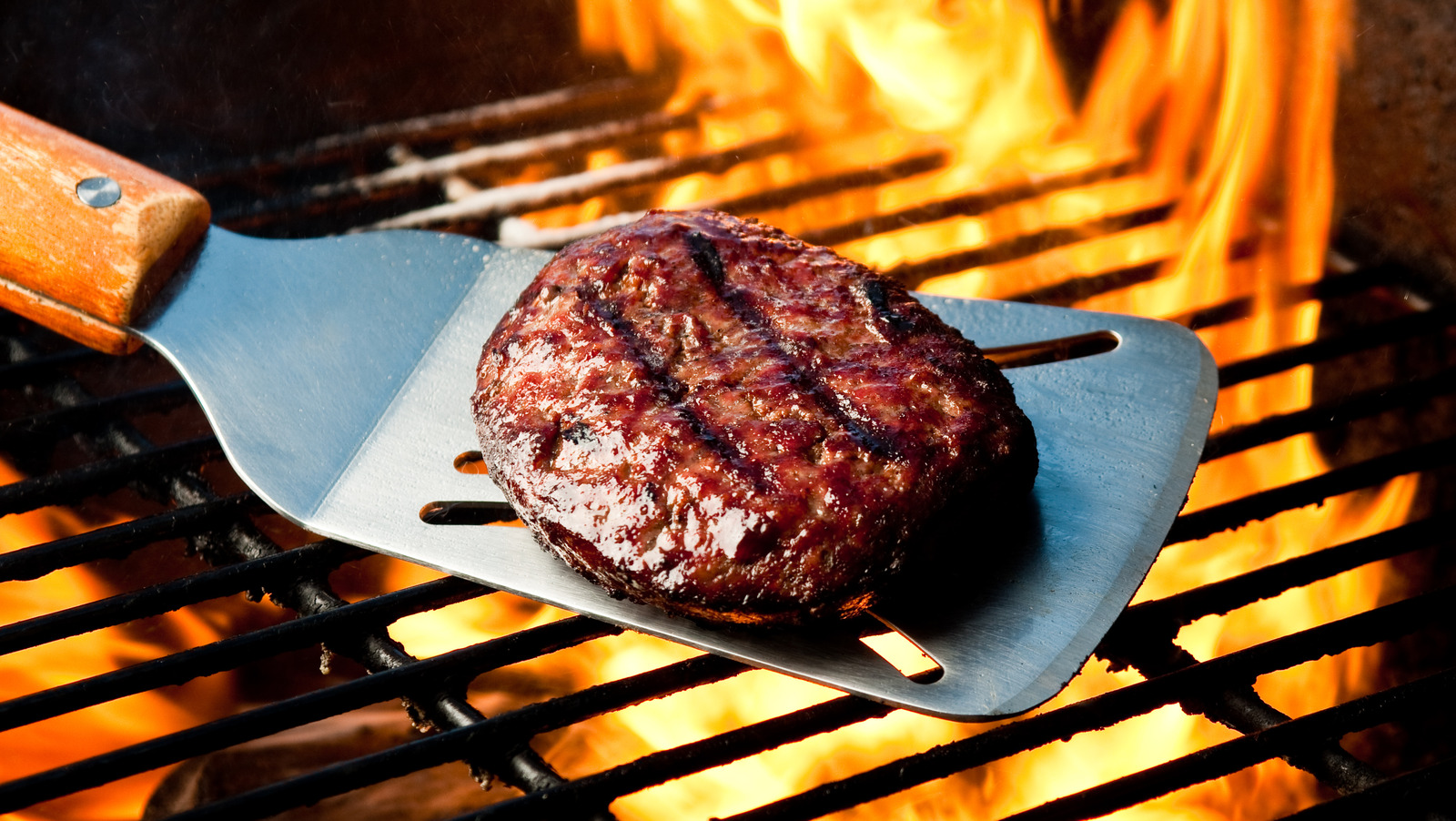 Burgers Tend To Crumble On The Grill, But There's An Easy Fix