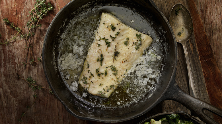 Butter-basted fish in cast-iron pan
