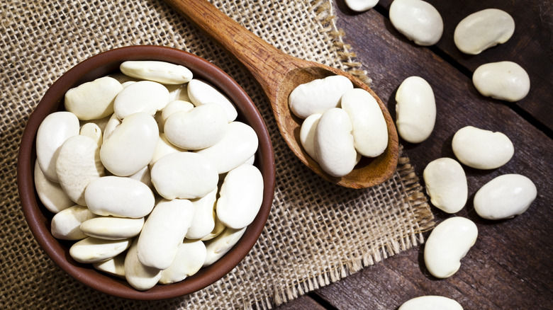 White butter beans in wooden bowl