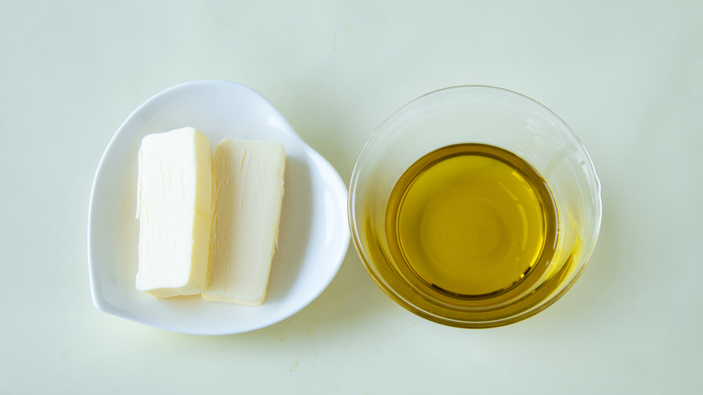 butter on a dish and oil in a ramekin