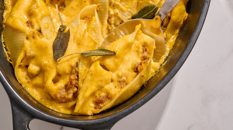 butternut squash stuffed shell in a casserole dish