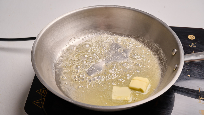 melting butter in a skillet