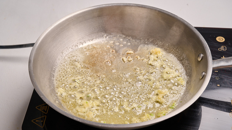 cooking garlic in a skillet