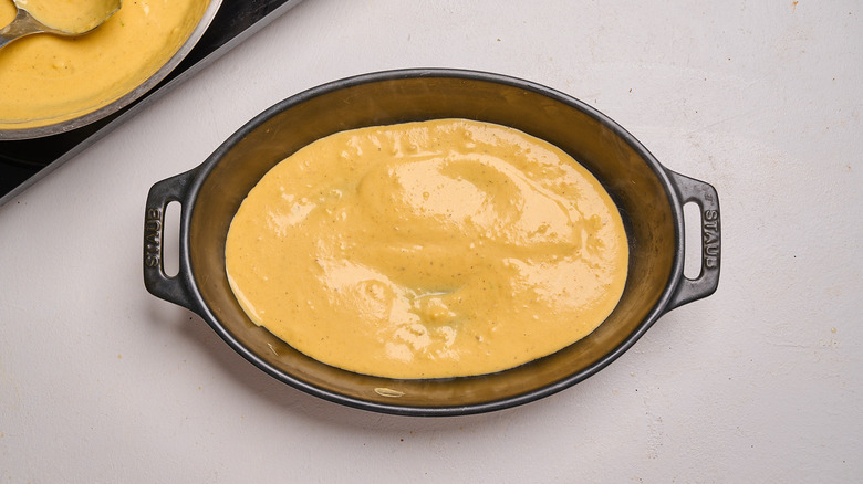 spreading sauce in a dish