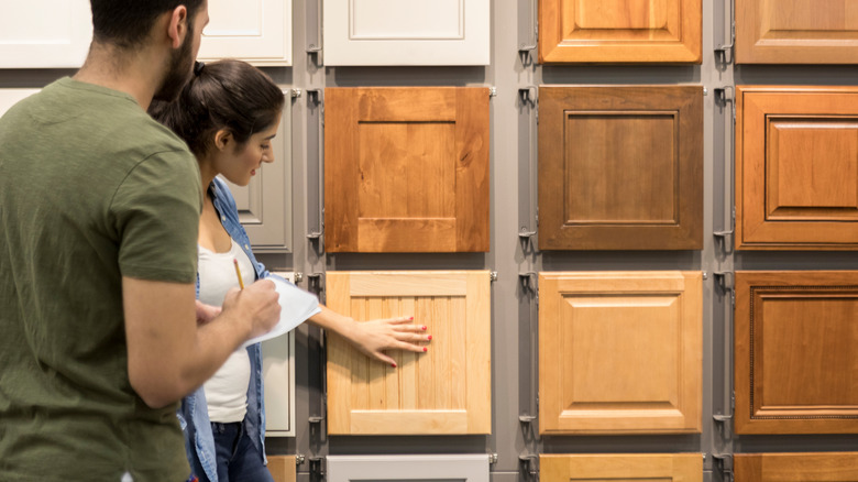 people shopping for cabinets