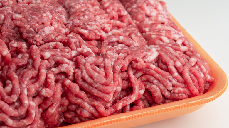 raw ground burger in tray