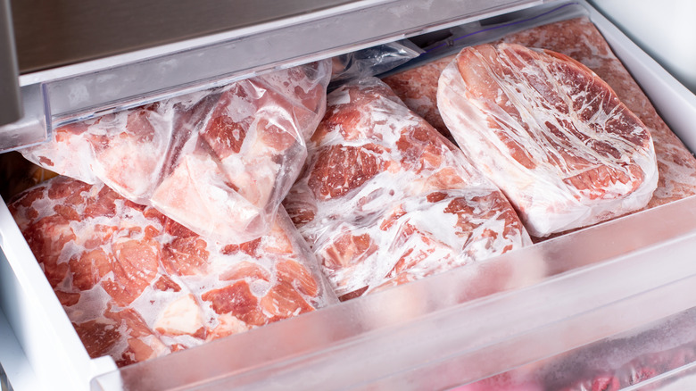 individually wrapped meat frozen in bin