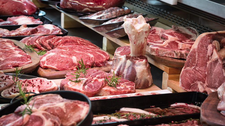 butcher shop display of different cuts of meat, mostly beef