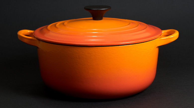 Close-up of an orange Le Creuset Dutch oven