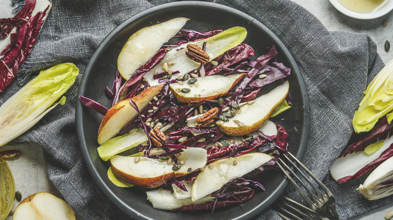 A salad with pears, radicchio, endives and nuts