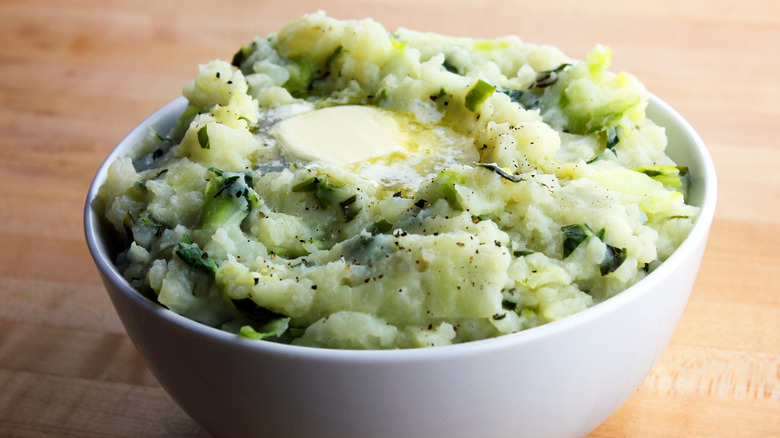 Bowl of mashed potatoes with cabbage