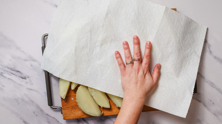 Drying potatoes on cutting board