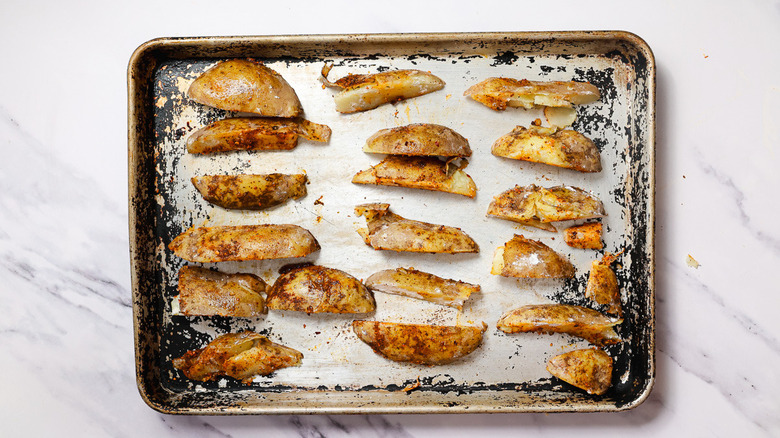 Raw fries on baking sheet