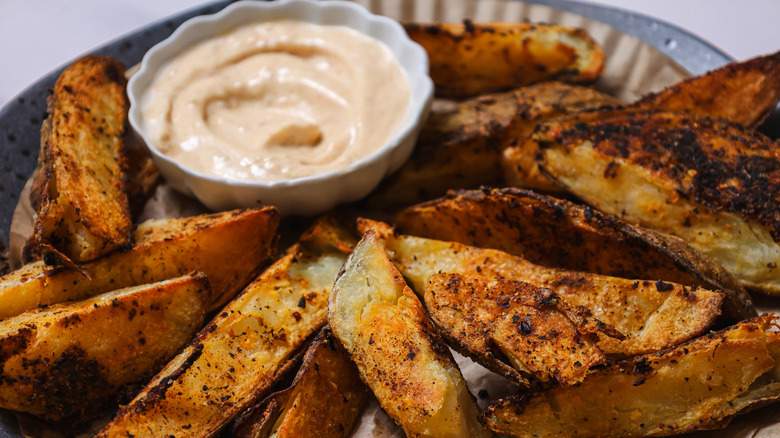 Dipping steak fries into aioli