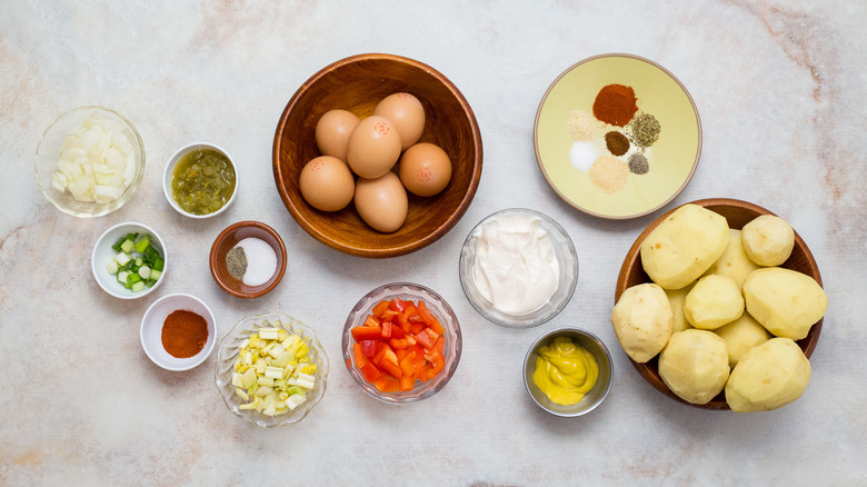 Cajun potato salad ingredients on table