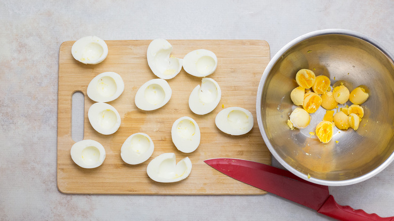 separated boiled eggs on table
