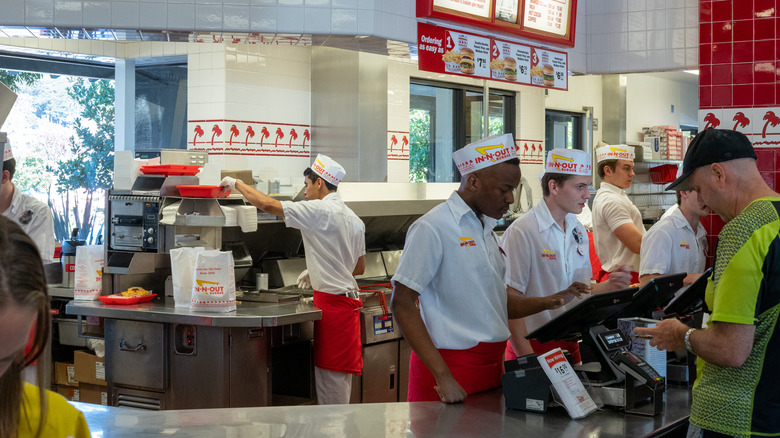 Fast food workers behind counter