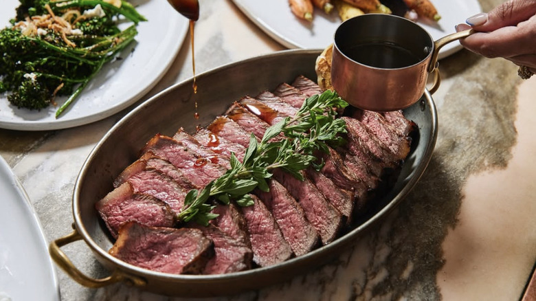 plated steak at Gwen Restaurant in Los Angeles with broccolini